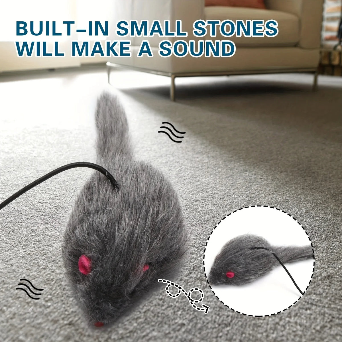 Jouet gris en forme de souris avec petites pierres sonores, posé sur un tapis.