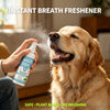 A person sprays a clear liquid breath freshener onto a happy golden retriever dog.