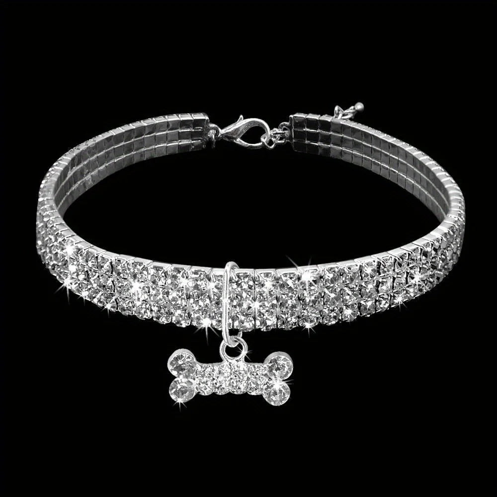 A sparkling jeweled bowknot pet collar for small dogs and cats displayed against a black background.