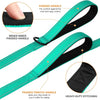 A close-up view of a teal and black heavy-duty dog leash showing padded handles for comfort and safety.