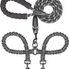 A black double dog leash with a shock absorbing bungee and metal clasps.