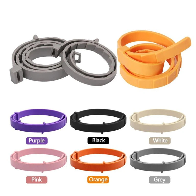A collection of adjustable silicone pet collars in various colors including purple, black, white, pink, orange, and grey.