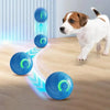 A dog is interacting with a blue interactive pet ball that emits light and movement on a wooden floor.