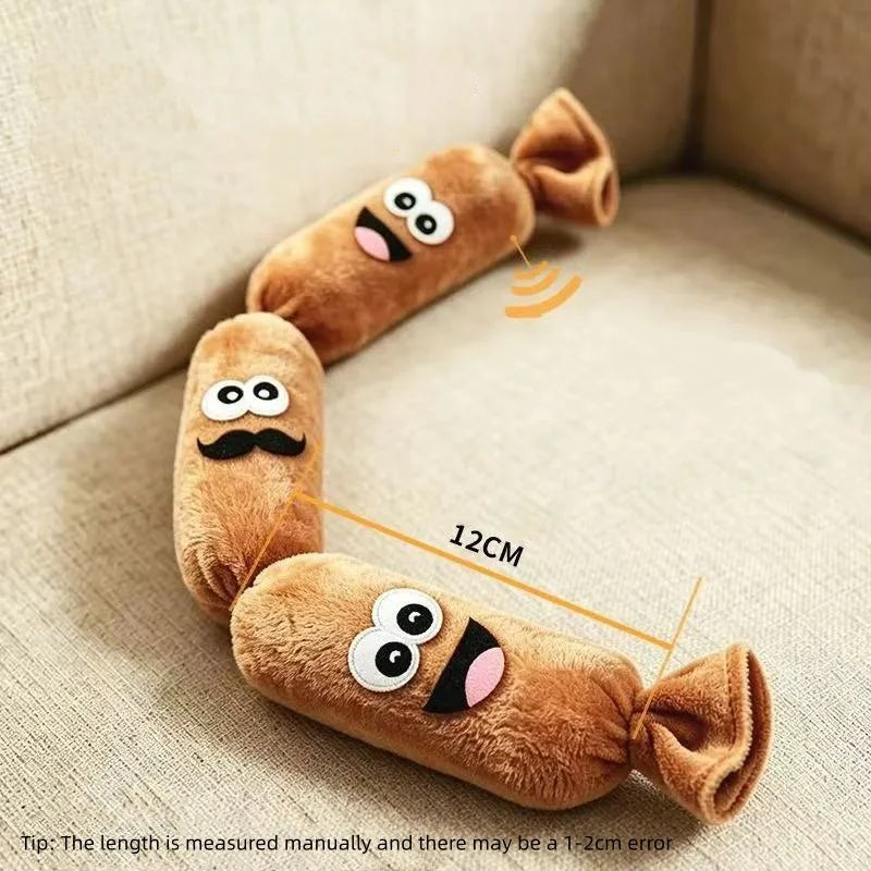 A brown, sausage-shaped plush squeaky dog toy is shown lying on a light-colored fabric surface.