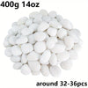 A pile of natural white polished pebbles for plants, vases, and aquariums, approximately 32-36 pieces.