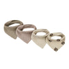 A set of four beige cotton baby bibs with printed designs for newborns.