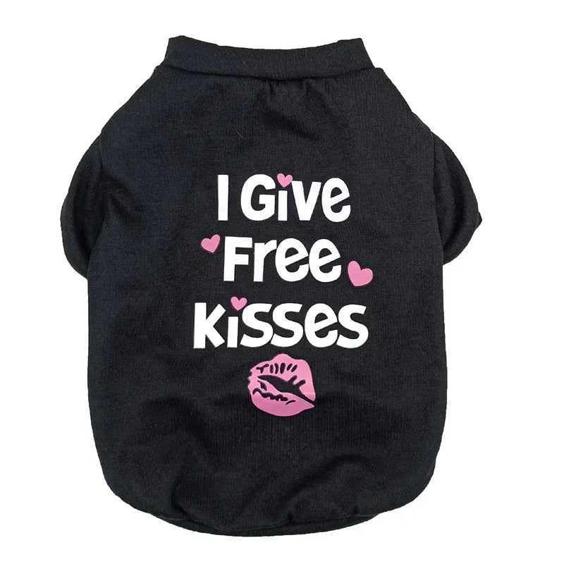 Black dog vest with white text that reads I Give Free Kisses and a pink lip print