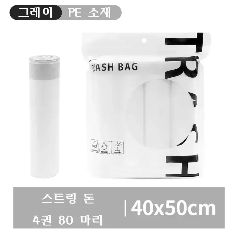 White polyethylene trash bags with black handles and a cylindrical dispenser shown next to the product.