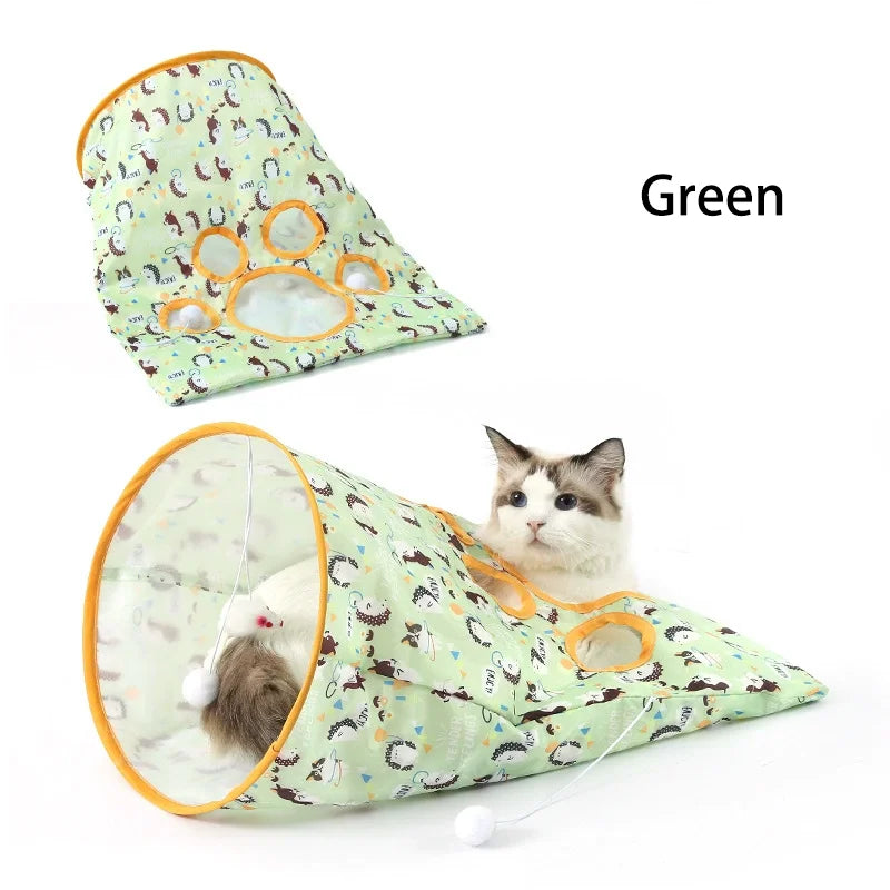 Green foldable crinkle cat tunnel with paw print design used as an interactive hideout for a cat.