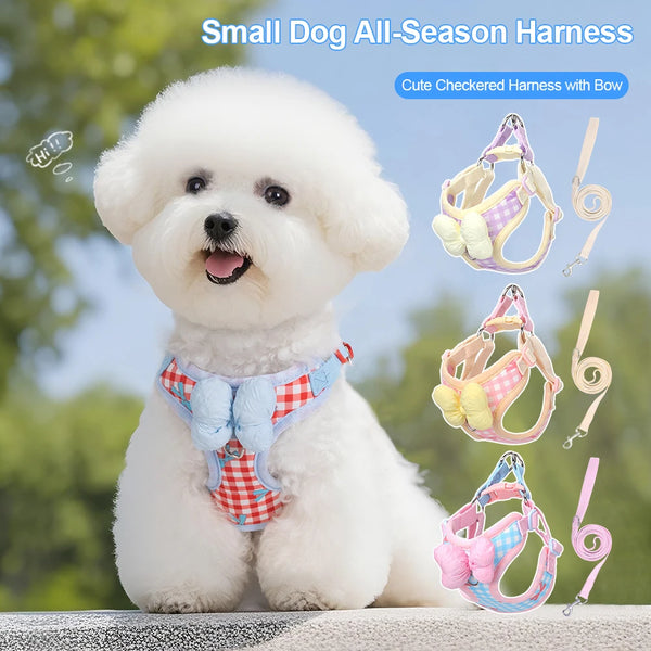 A fluffy white dog wearing a cute checkered harness with a bow, shown next to various harness accessories.