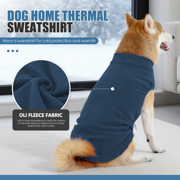 A dog wearing a navy blue fleece sweatshirt designed for cold protection and warmth.