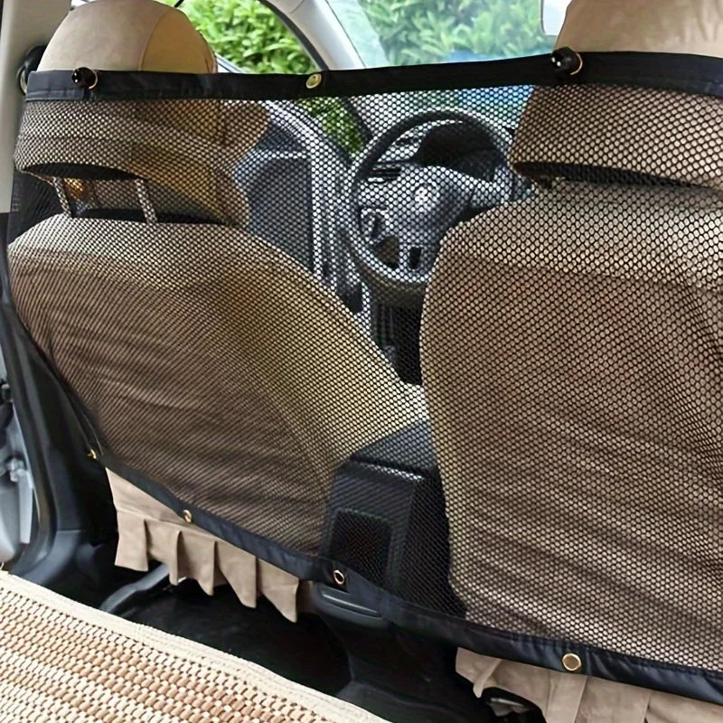 Two beige pet safety nets are visible in the interior of a car, positioned over the front seats.