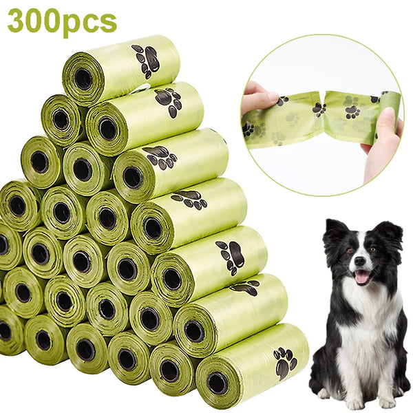 A stack of 300 rolls of biodegradable extra-thick dog poop bags in lime green, with a hand demonstrating the product size.
