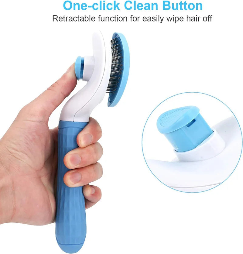 A hand holds a blue pet grooming brush with a retractable cleaning button, showing the brush head and handle.