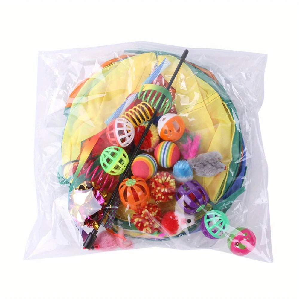 A clear plastic bag contains an interactive cat play set with a collapsible tunnel, feather teaser wand, and crinkle balls.