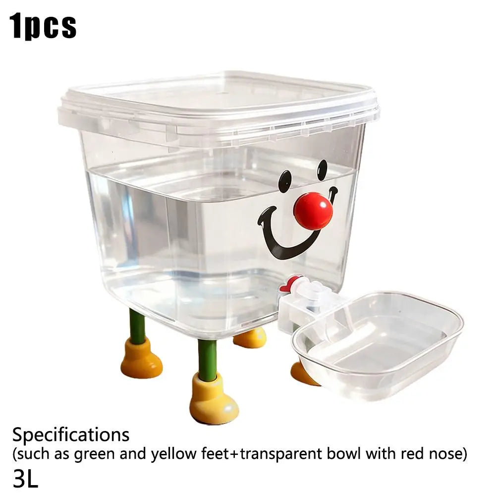 A clear plastic pet water bowl with a red nose and yellow feet, designed as an automatic gravity fountain.
