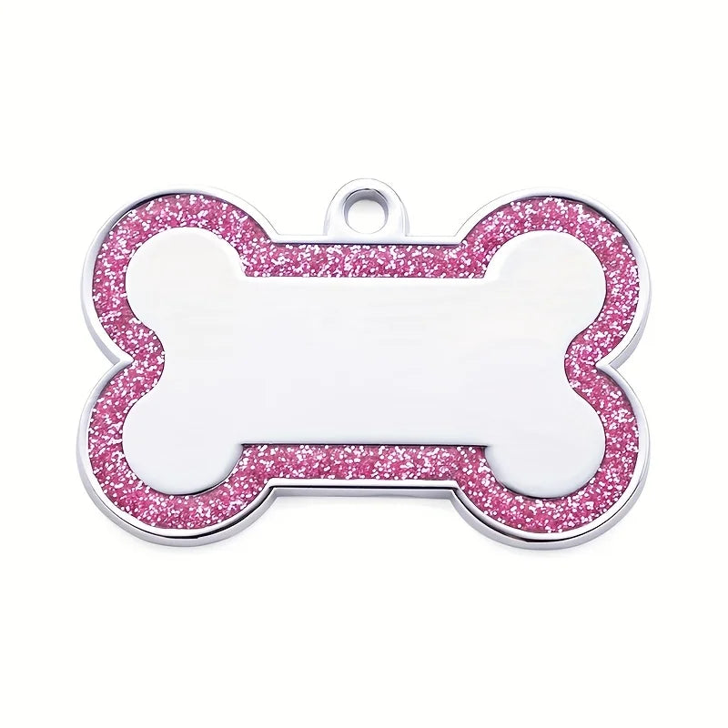 Silver pet ID tag shaped like a bone with pink glitter outline and a blank white center.
