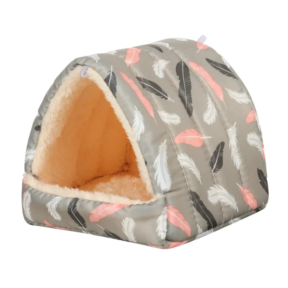 A gray flannel pet nest bed shaped like a house with soft, fluffy lining and feather patterns.
