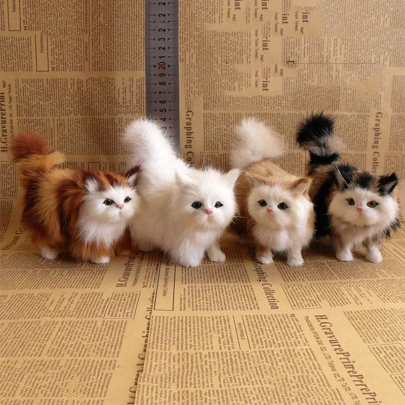 A row of fluffy, realistic simulation cat plush toys in various orange and white colors sitting on aged paper.