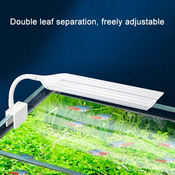 White clip-on LED aquarium light with double leaf separation adjusting a plant life view.