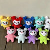 A collection of twelve colorful kawaii Momo plush keychains arranged in a row.
