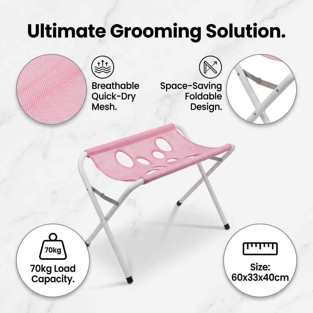 Pink foldable pet grooming hammock station with a lightweight frame and mesh surface for bathing and nail trimming.