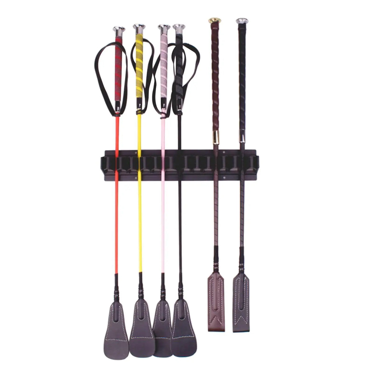 A wall-mounted rack displaying various colored whips and canes with black handles.
