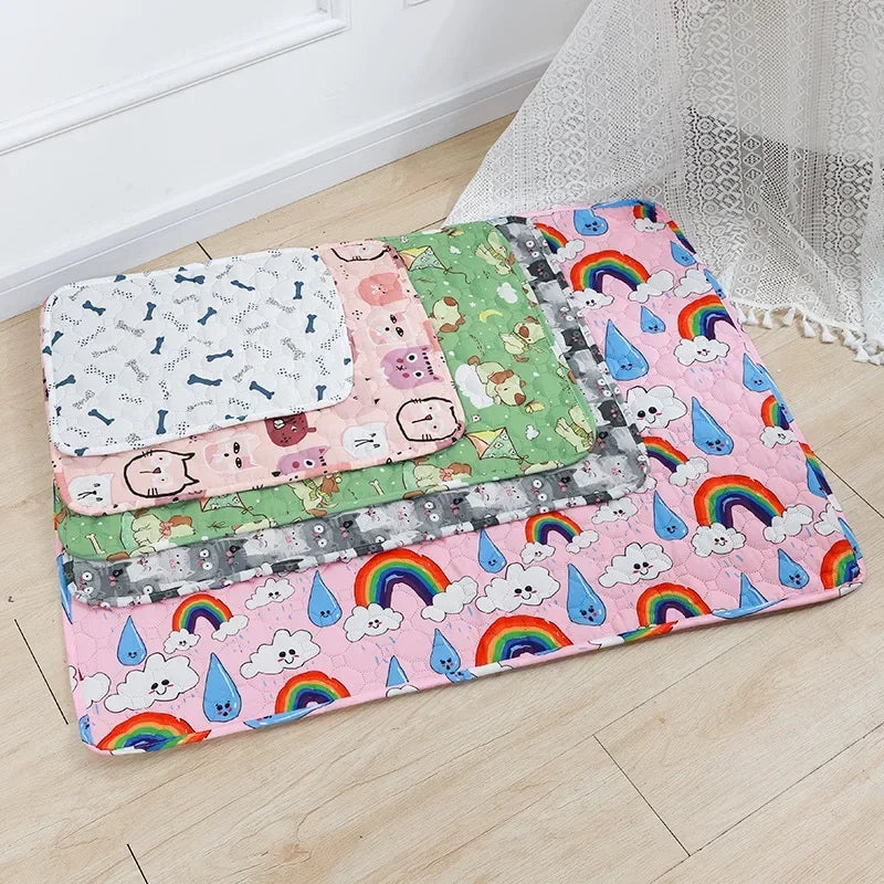 A colorful washable pet training mat for dogs featuring various patterns and rainbow designs.