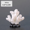 White resin coral decoration measuring 4.6x4.1cm mounted on a dark base