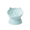 Light blue ceramic pet food bowl with a raised slanted design
