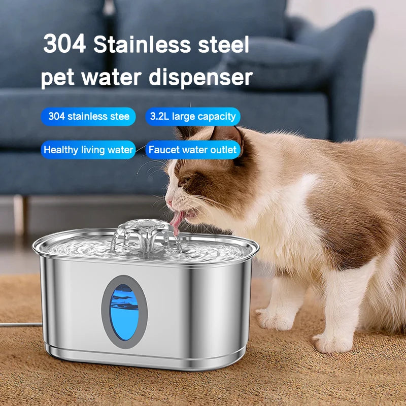 A brown and white cat is drinking water from a stainless steel pet water dispenser fountain.