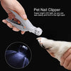 A hand holds a pet nail clipper, demonstrating its use for trimming pet nails with a bright LED light.