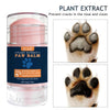 A glass jar of plant extract paw balm with a close-up of a dog's paw.