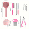 Pinkes Tierpflege-Kit mit Bürste, Kamm, Nagelscherer und Pflegewerkzeug.