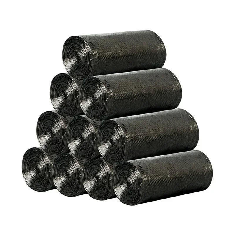 A stack of black disposable plastic garbage bags with tie handles rolled up.
