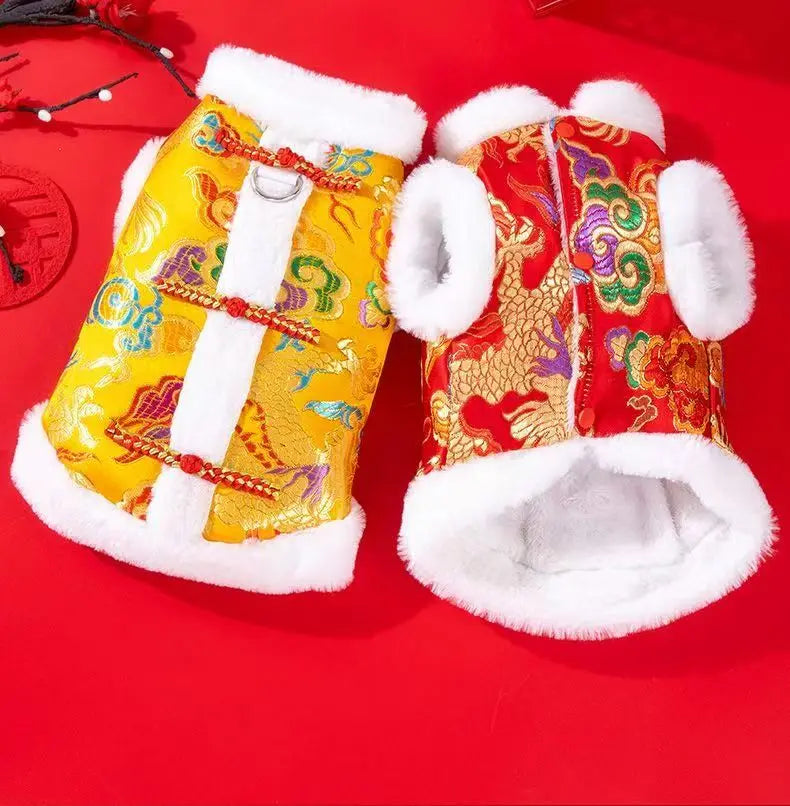 A pair of Chinese style tang suit dog coats in red and gold with white faux fur trim.