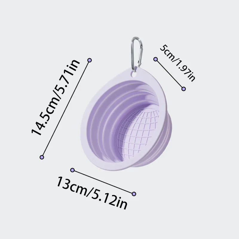 A purple collapsible silicone pet travel bowl hanging from a loop, shown with various size measurements.