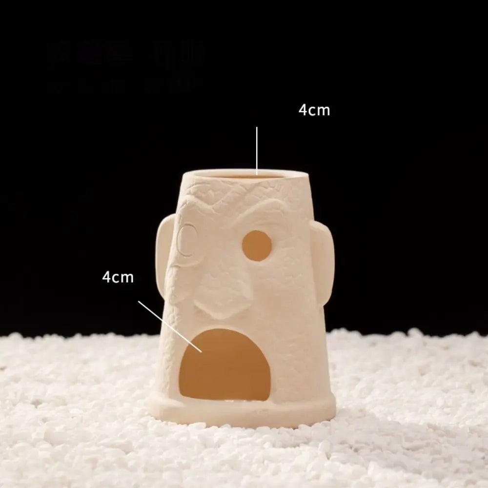 A beige ceramic aquarium shrimp hideaway cave with measurements marked on the side.