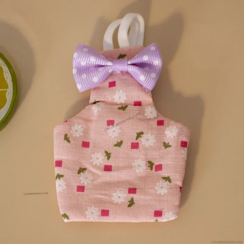 Pink fabric parrot flight suit with a purple bow tie