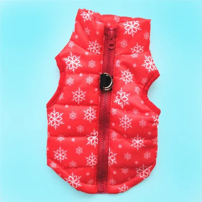 A red quilted winter dog coat with white snowflake patterns and a black zipper.