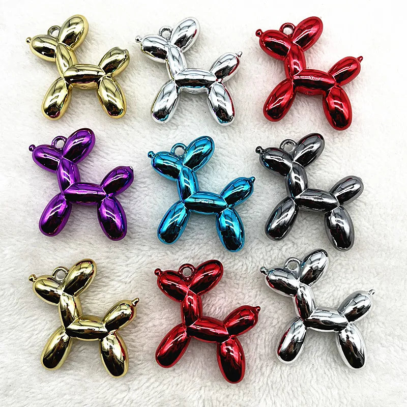 A collection of eight colorful acrylic balloon dog charm pendants in various metallic and iridescent finishes.
