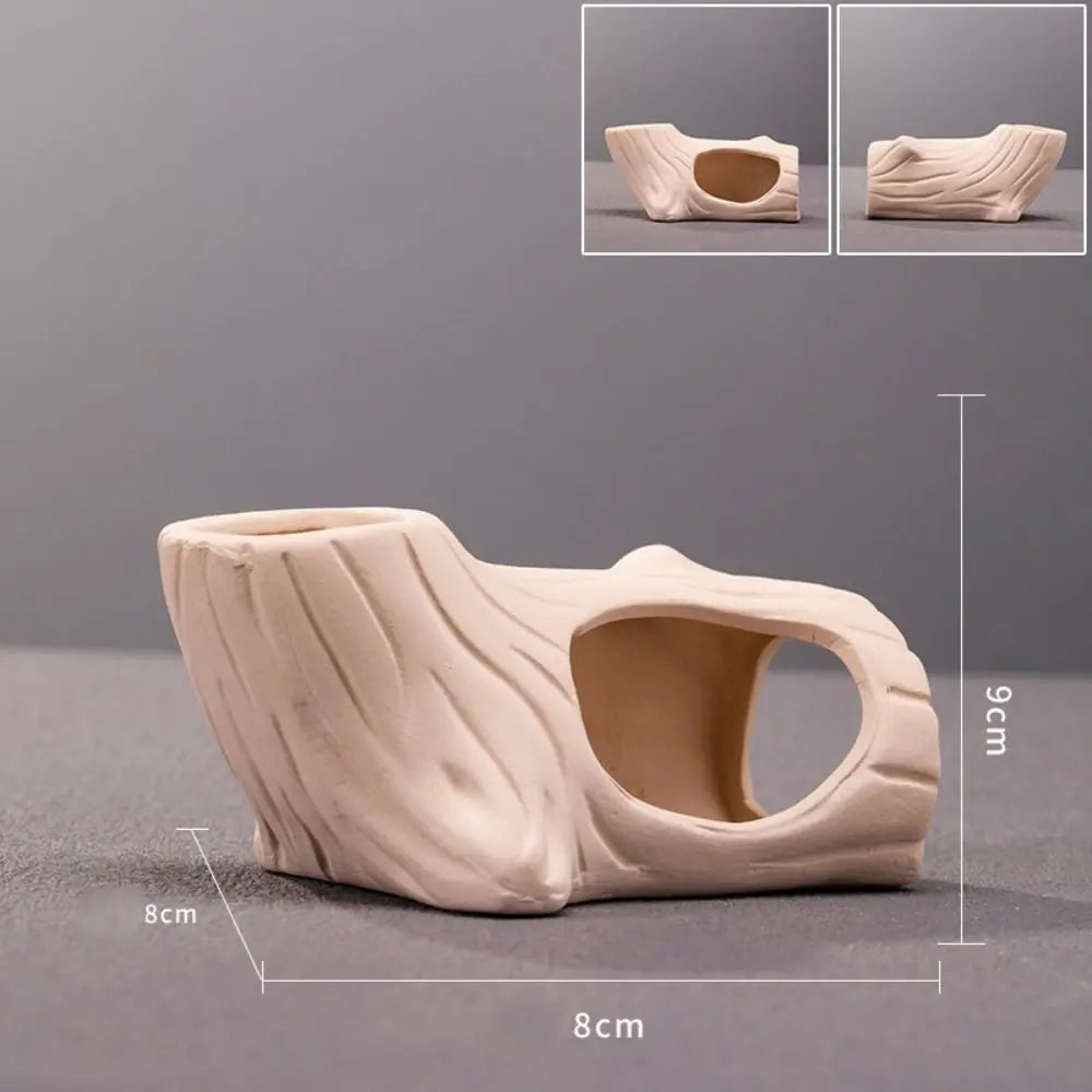 A beige ceramic aquarium shrimp hideaway cave with a natural, sculpted texture.