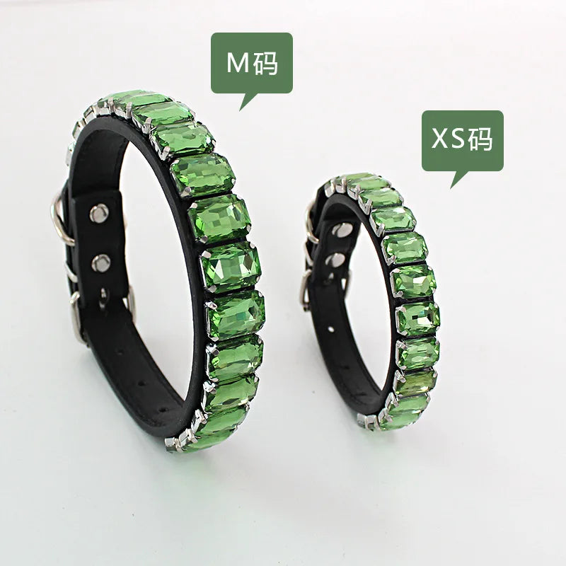 Two green crystal rhinestone dog collars, labeled M and XS sizes.