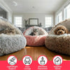 A collection of plush pet beds in various shades of gray and brown, including a fluffy cat bed and a dog bed.