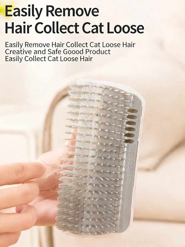 A hand holds a clear silicone cat loose hair comb with a corner mount, showing the bristles and plastic body.