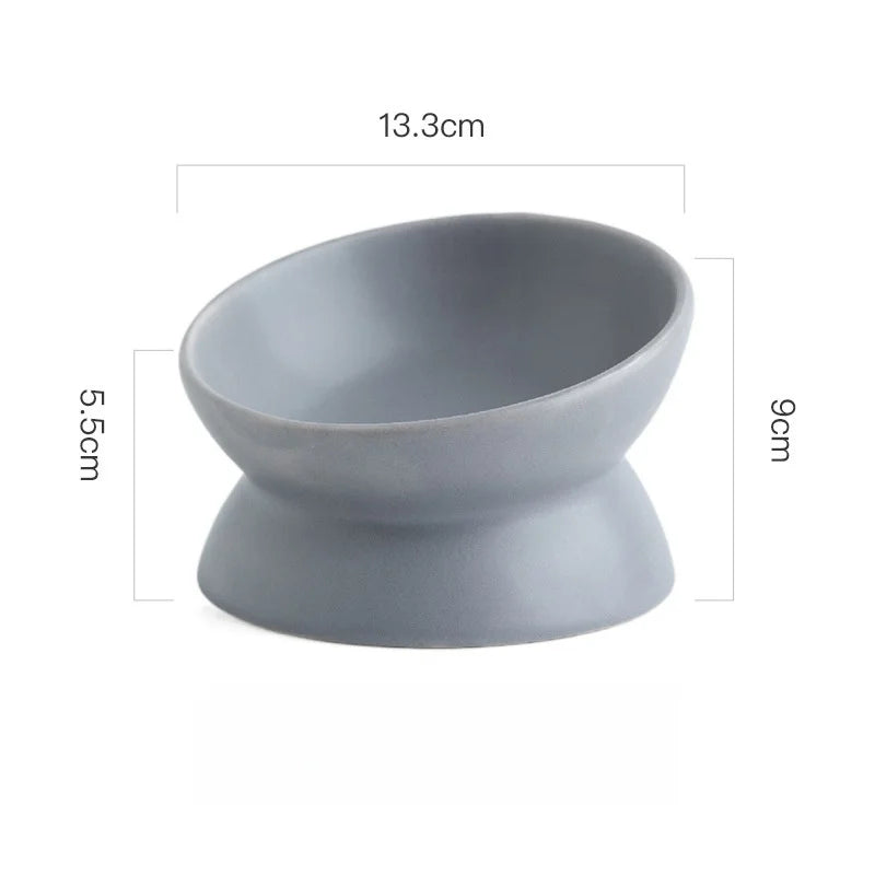 A gray ceramic cat bowl with a raised stand, measuring 13.3cm in length and 9cm in height.