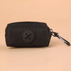 Black fabric pouch with a circular black cross emblem attached to a metal carabiner clip