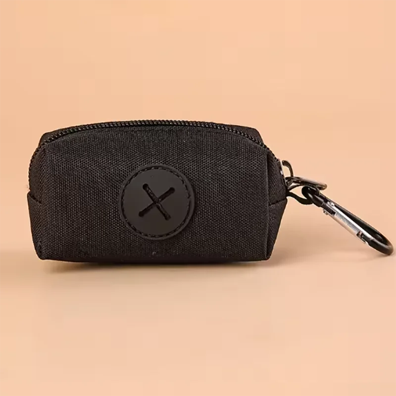 Black fabric pouch with a circular black cross emblem attached to a metal carabiner clip
