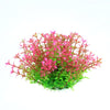 Un groupe de plantes aquatiques artificielles avec du feuillage rose et vert pour décorer un aquarium.