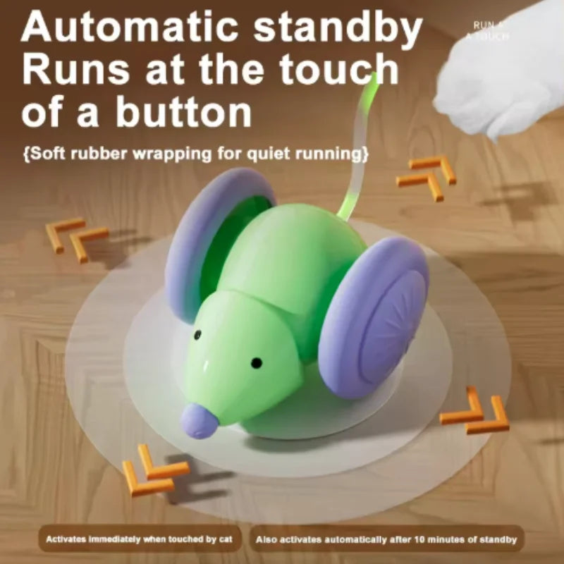 A green and purple interactive cat toy with a feather is shown on a wooden surface.